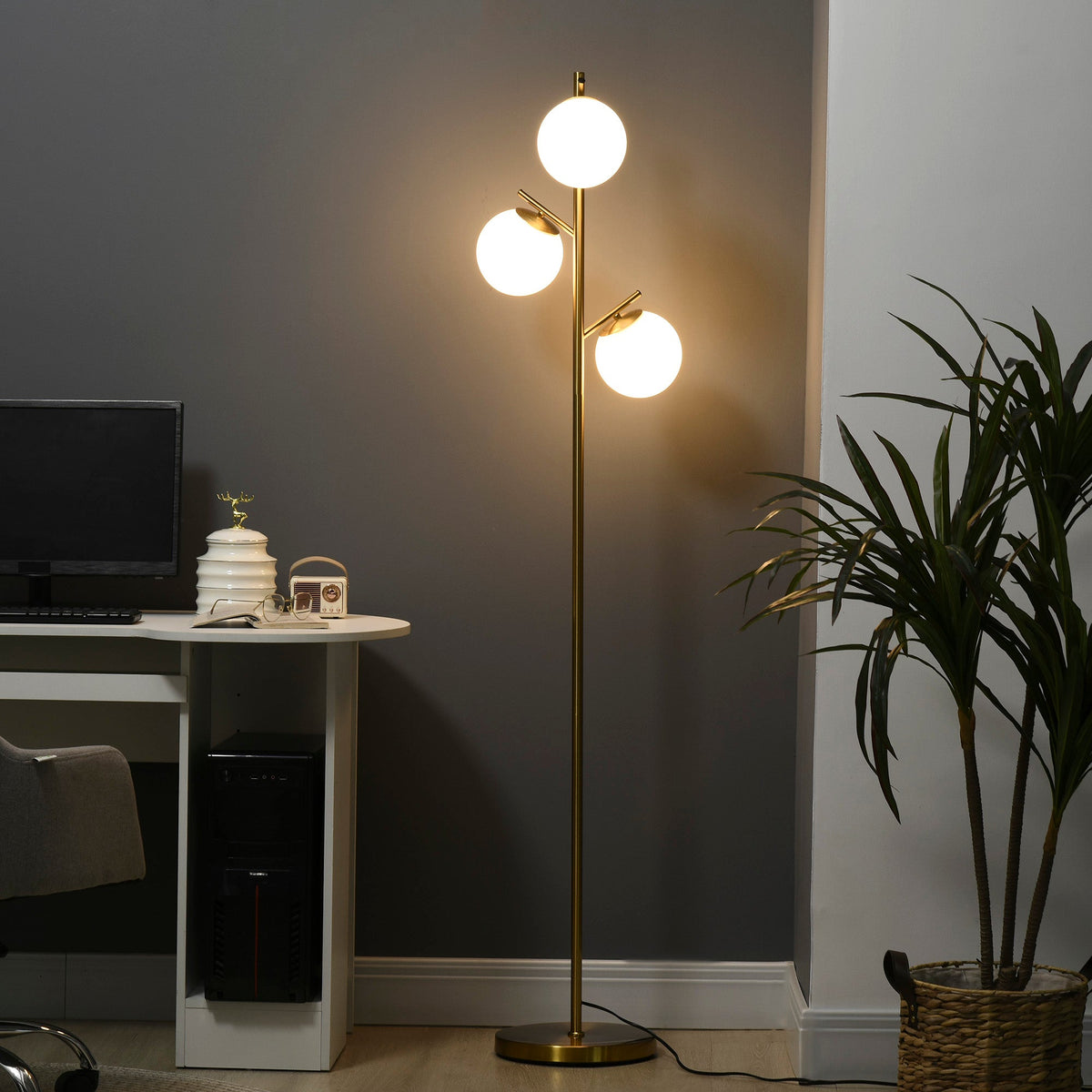Gold three-globe floor lamp detail