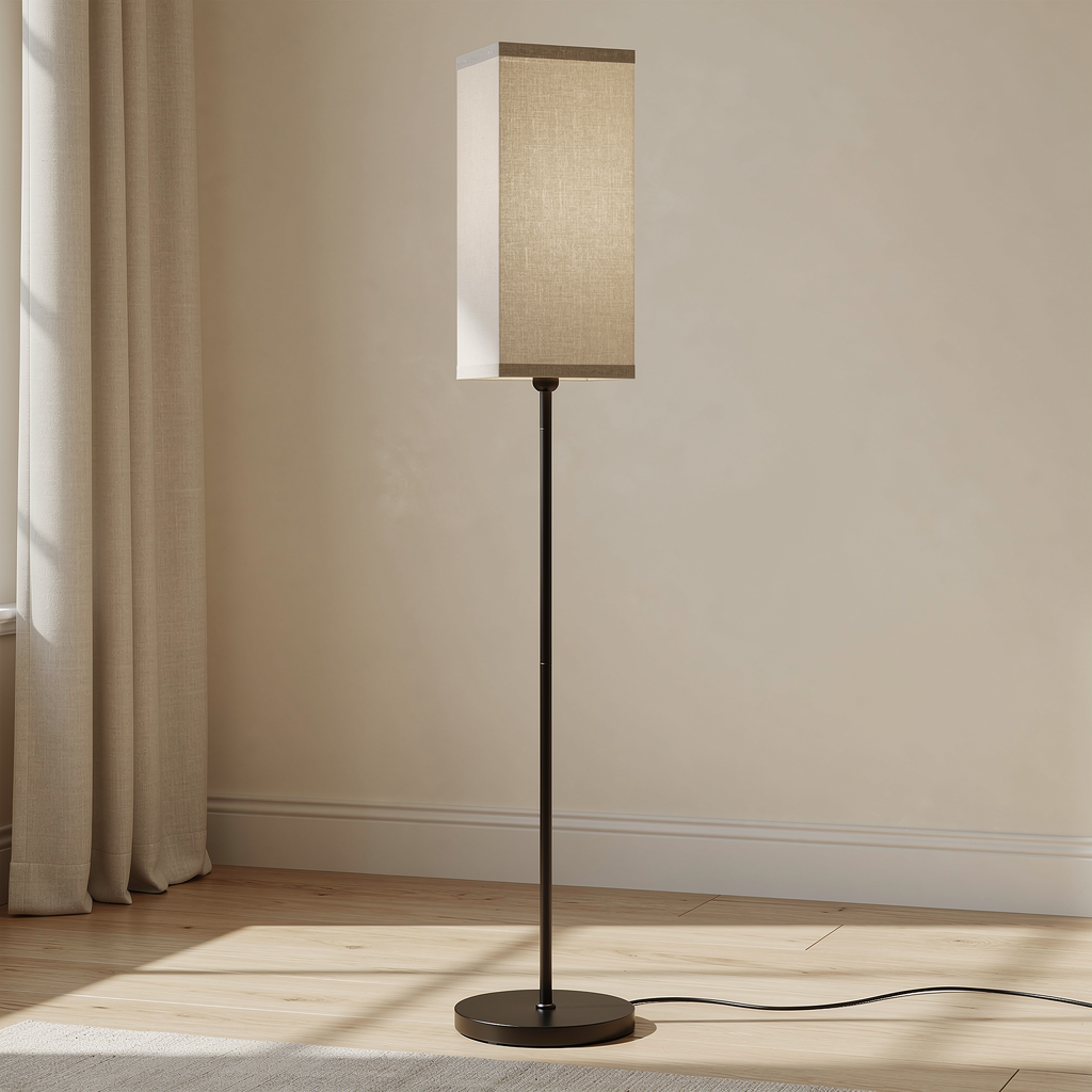 Rovenmere black floor lamp with beige linen shade in a warm neutral living room
